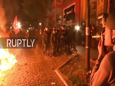Police fight flames near Hamburg's Rote Flora squat during G20