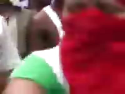 Muslim woman in a red burka beats up a man  