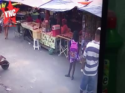 Man is assassinated on the Street Standing Right Next to Young Girl carrying Her Backpack 