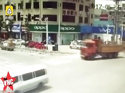 [1000th video] A truck runs over and kills two girls riding a motorised bicycle