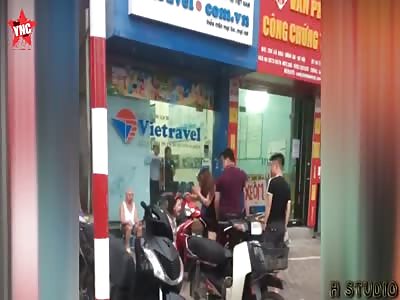 loving husband punches his wife in the face next to there child in Vietnam