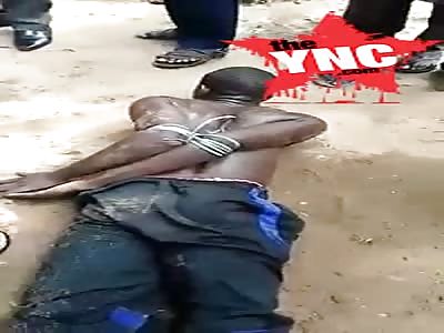 Nigerian Man Caught Wearing Cloth Stolen From A Boutique In Umuahia Beaten & Tied
