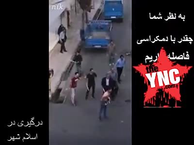 a large fight on the streets of Islamshahr in Iran 
