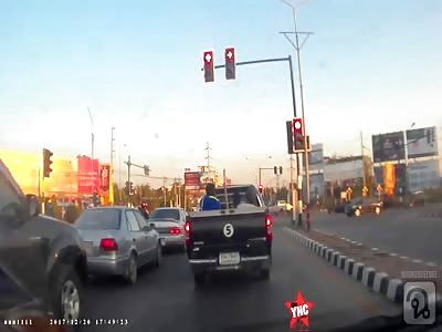 accident in Thailand @1:10 mark traffic lights fall onto a woman while she was on her bike