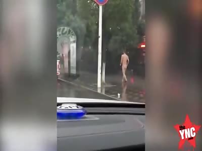 man on drugs walks down the street naked in Wujin District