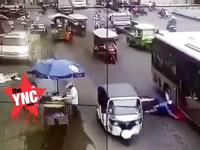 youth gets his head crushed  under a bus in Phnom Penh,Cambodia 