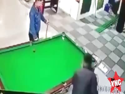 a brother hits another brother with snooker ball into the private area