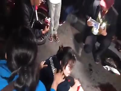 in Cambodia woman cries over her dead boyfriend after the guy who did it is beaten up