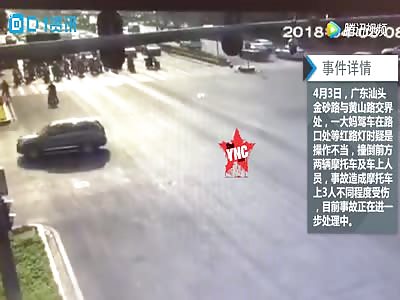 woman did not see the  motorcycles infront of her in  Guangdong 