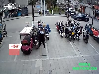 A car collides into two motorcyclist in Jiangsu