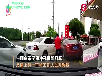 sedan car crushed a man's legs at a petrol station in Zhenjiang