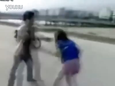 Chinese man beats down woman in the street