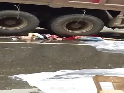 Two Chinese girls are flattened by a dump truck.