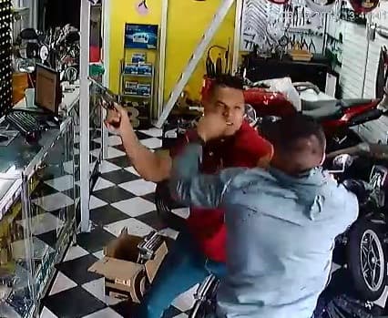 Dramatic Video Shows Customer Fighting off Armed Robber