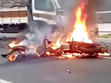 Man on Fire.. Motorcyclist Burns alongside his Motorbike 