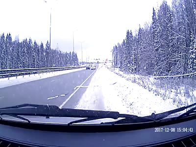Russian taxi driver reversing up highway.