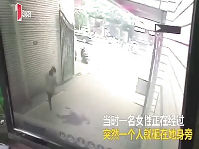 Woman jumps to her death nearly hitting pedestrian.