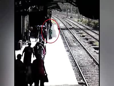 Woman jumps in front of a train
