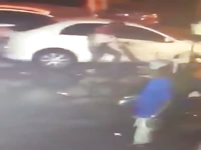 Thug attacks two men with a machete outside a club then calmly walks away
