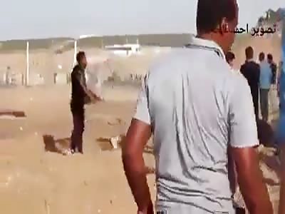 Palestinian protester Gets shot by an Israeli sniper