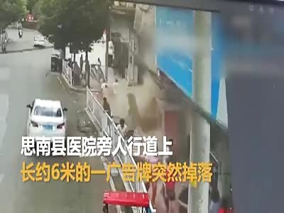 Sign Collapses Onto Pedestrians in China