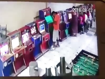 Swift Execution of Man Playing at an Arcade Machine