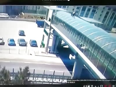 Suicidal Asshole Slides from Bridge onto Speeding Car