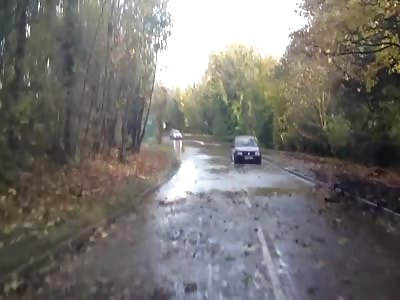 OVERCONFIDENT DRIVER CHALLENGES FLOOD, AND...