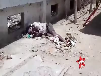Shit  Corpse of a woman lying on the street, nobody cares