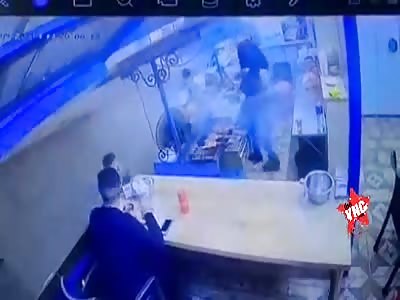 Hitman murders two young men while they eat