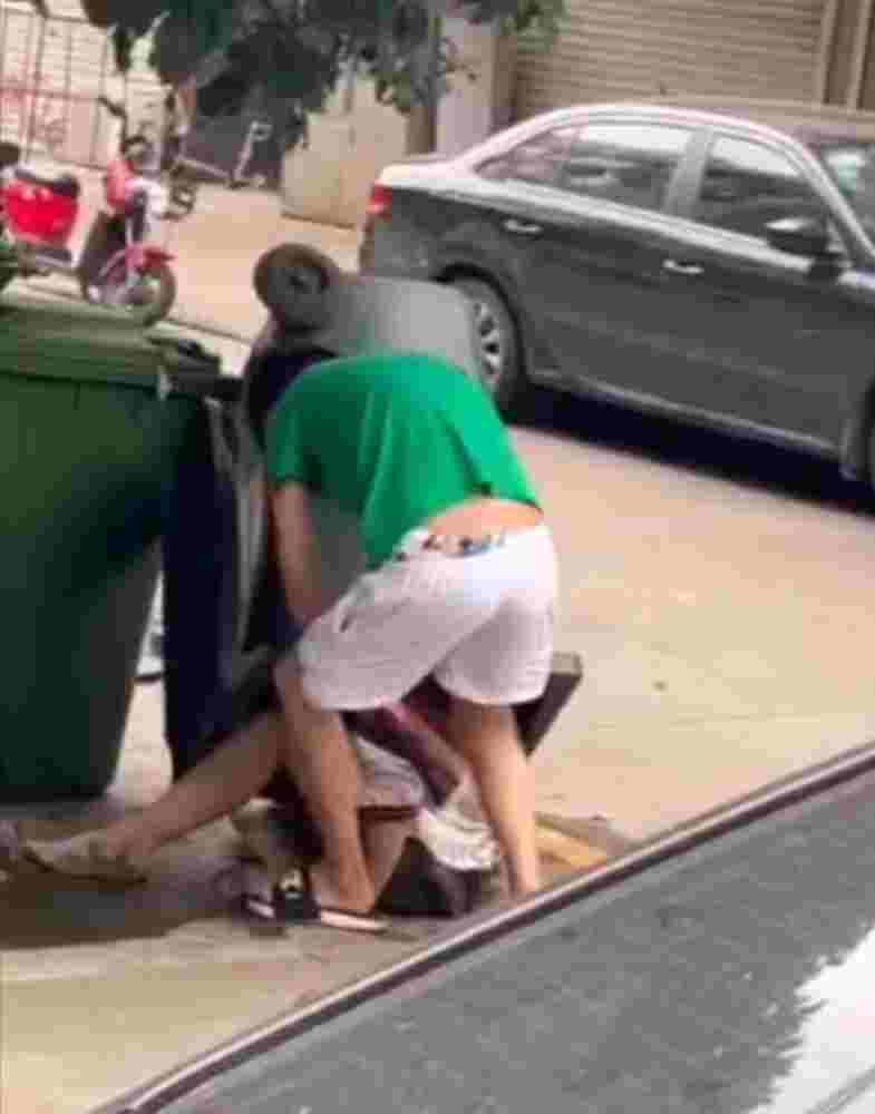 Son of a bitch puts his girlfriend in the garbage can