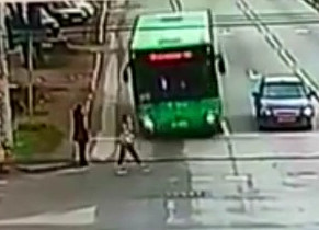Woman struck by Bus