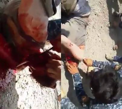 Excited Iraqi Soldier Slowly Cuts Daesh's Throat