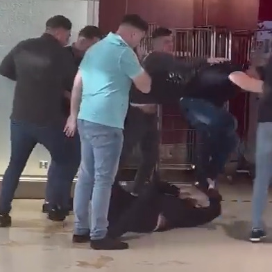 Shocking Moment a Man Is Stamped on the Head In Dublin Airport's Departures Terminal Following Mass Brawl as Families Cower In Terror