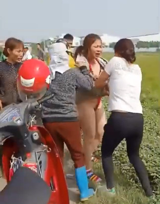 Vietnamese Female Being Stripped Naked and Lightly Beaten