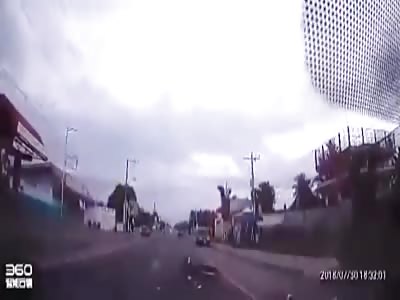 Scooter driver hits a car head-on.