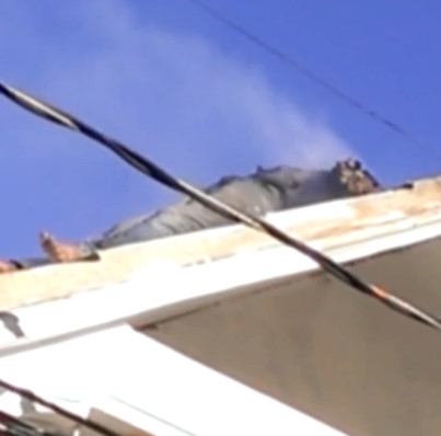 Electrocuted Man on Rooftop is Still Smoking and Burning