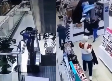 Kid Falls Off Iraqi Mall Escalator Directly On Woman's Head