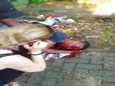 Horrifying moment man writhes in agony on the ground 'after being blasted in the face with a shotgun