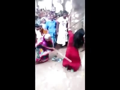 Woman getting hit with sticks 