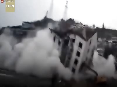 Building demolition goes wrong, crushing excavator driver