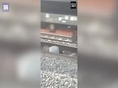 Man falls onto rail tracks in India narrowly avoiding death