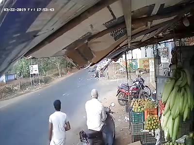 Speeding bike rams woman scooter rider who abruptly stops on road