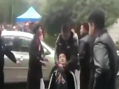 Tourists admiring cherry blossoms in China are beaten by security