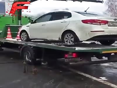 Man Drove His Car Off A Tow Truck