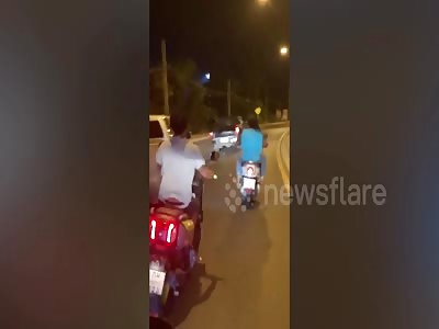 Elderly Thai man clings to pal's car bonnet after they had an argument