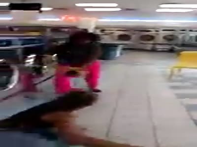 black girl smashes white girl in a laundrette