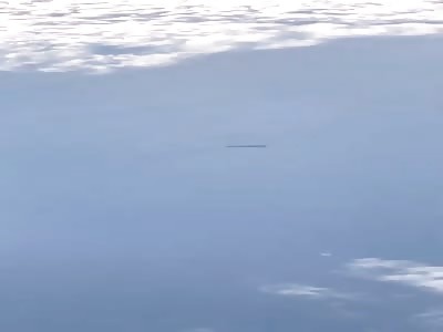 Cigar UFO Filmed from Plane over UK
