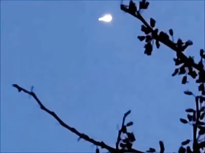 Cigar shaped UFO filmed by Incredulous Woman