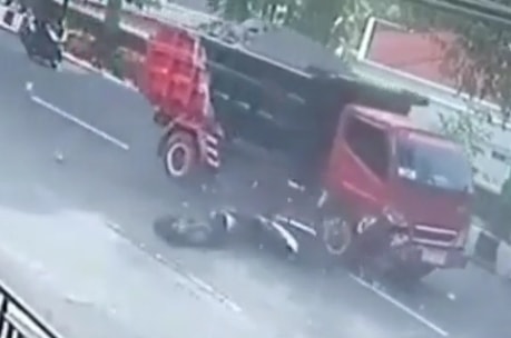 Biker Hits Dump Truck Head On